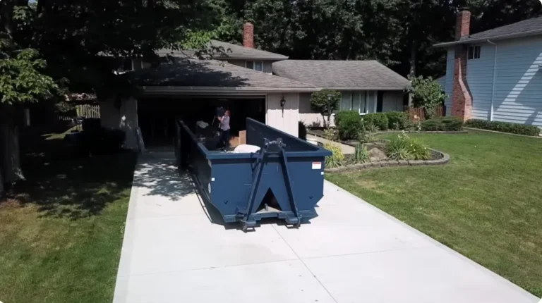 Roll-off dumpster rental on a driveway in Asheville NC